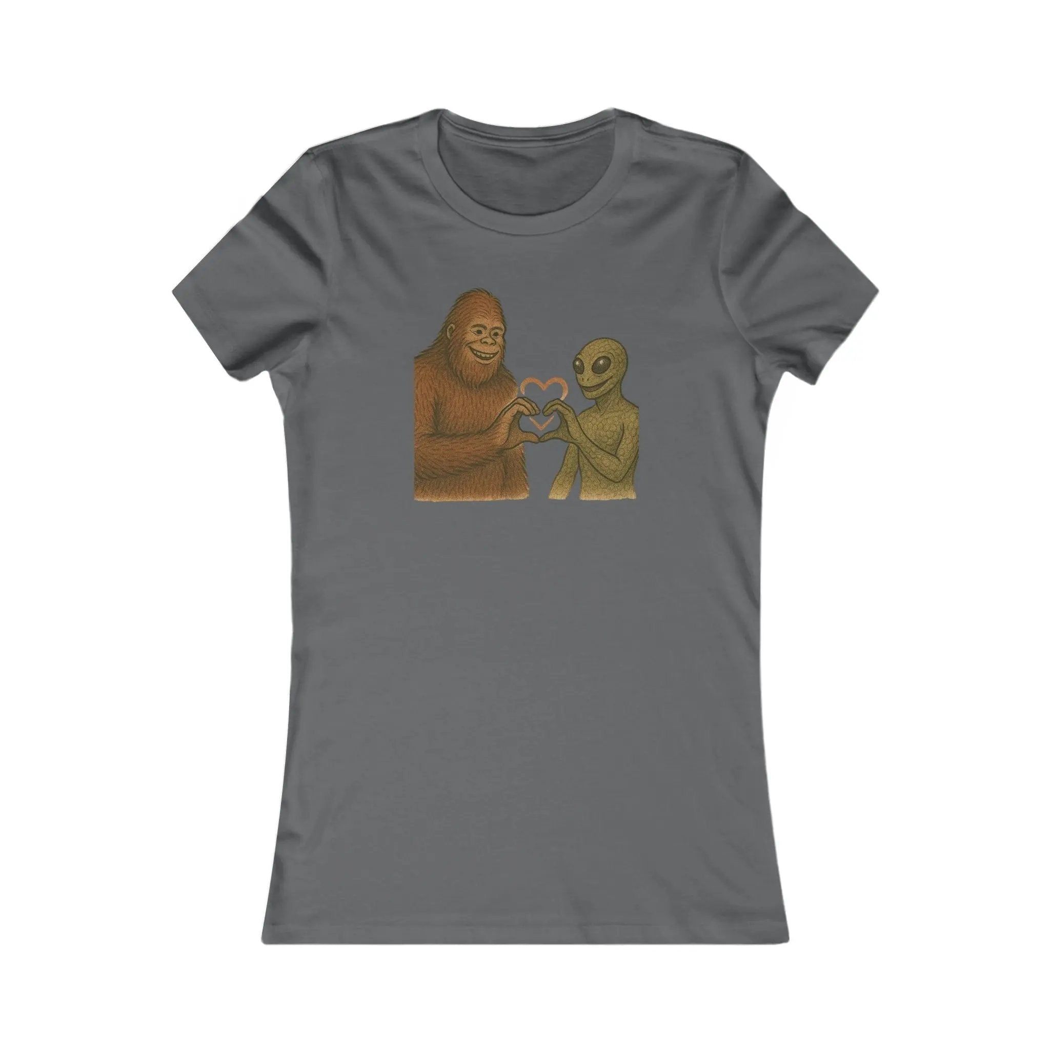 Gray t-shirt with a graphic of a bigfoot and an alien holding hands making a heart symbol on a white background