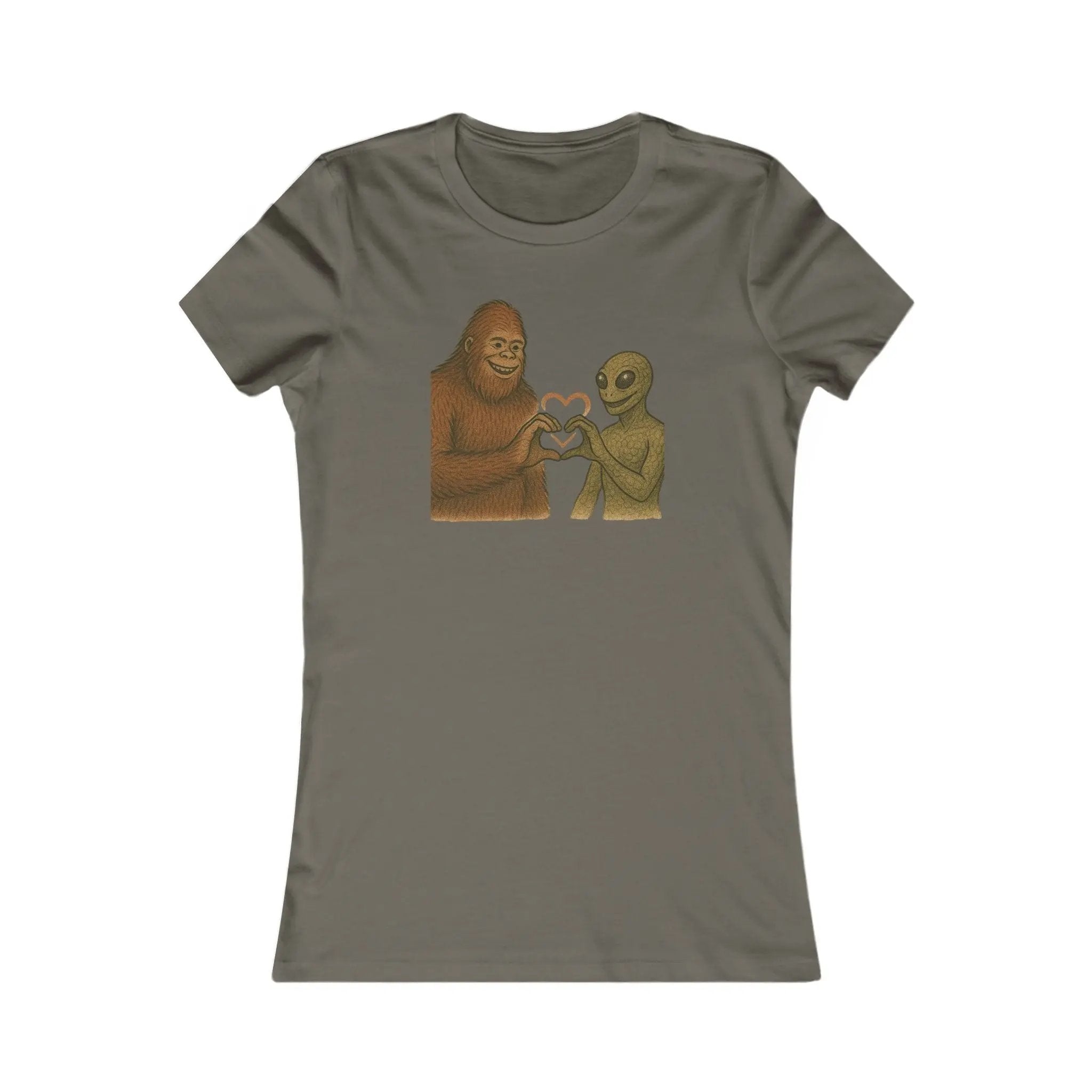 Gray t-shirt with a graphic of a bigfoot and an alien holding hands making a heart symbol on a white background