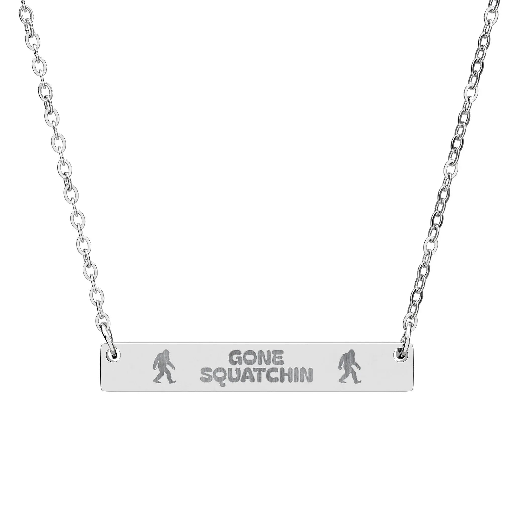 Silver necklace with 'Gone Squatchin' pendant on a white background