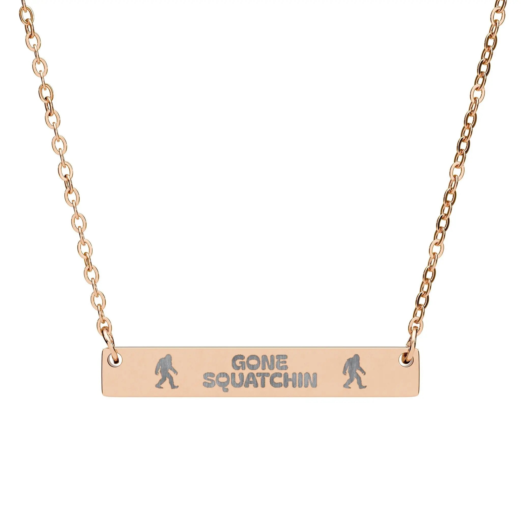 Rose gold necklace with 'Gone Squatchin' bar pendant on a white background