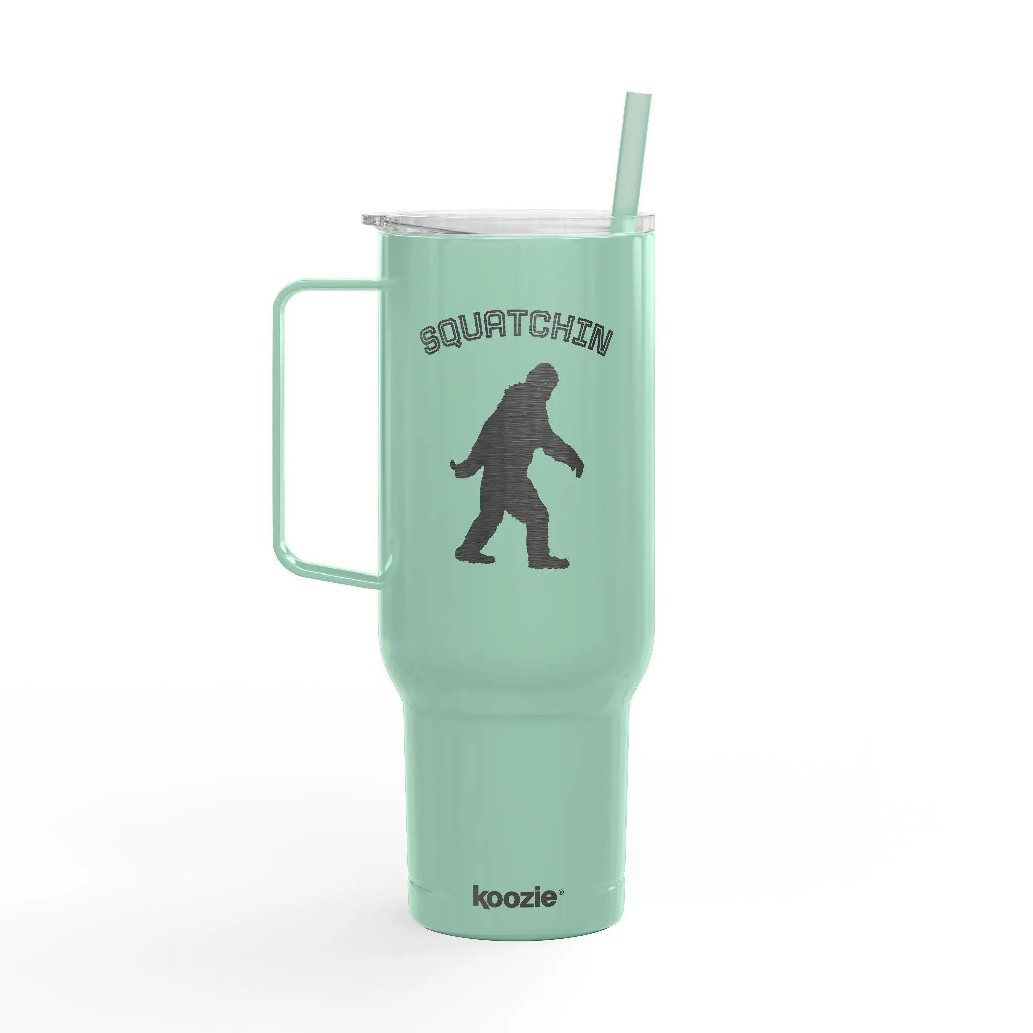 Mint green tumbler with 'Squatchin' and a bear graphic on a white background