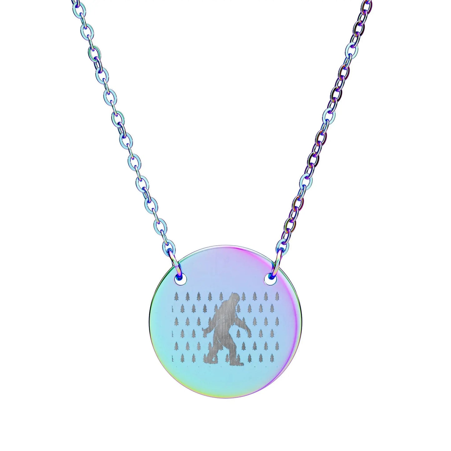 Necklace with a round, iridescent pendant featuring a silhouette of bigfoot and small trees on a white background