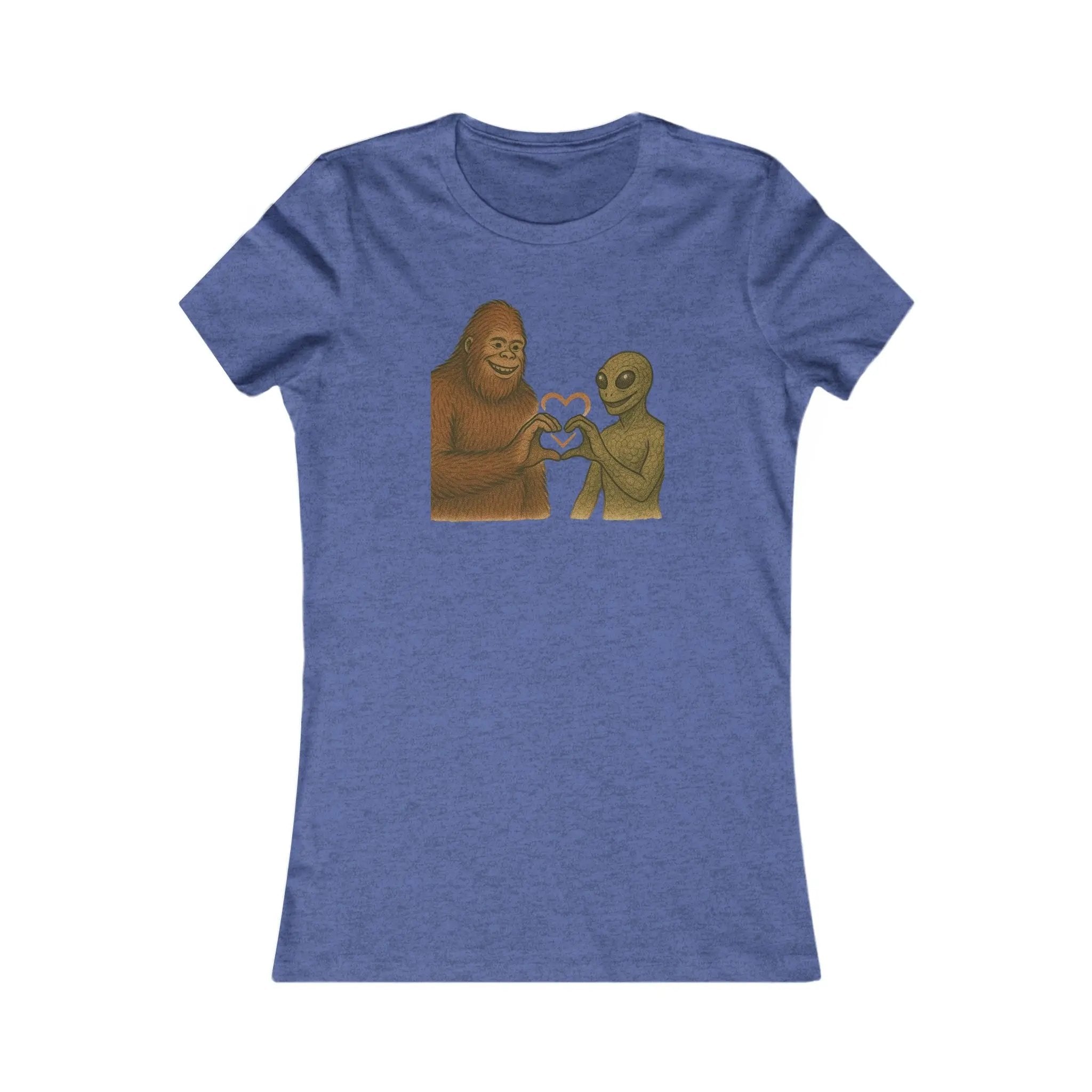 Blue t-shirt with a graphic of a bigfoot and an alien holding hands making a heart symbol on a white background