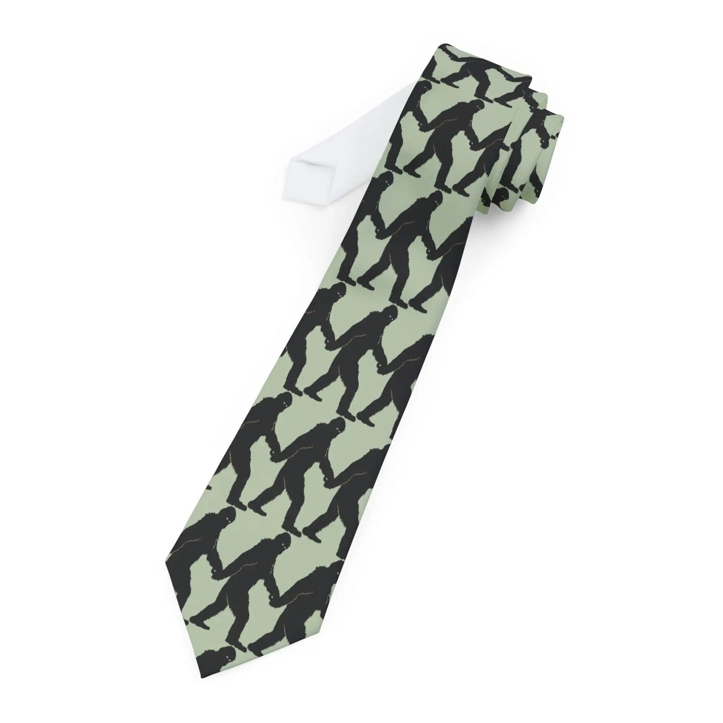Tie with black bigfoot silhouette pattern on a light green background