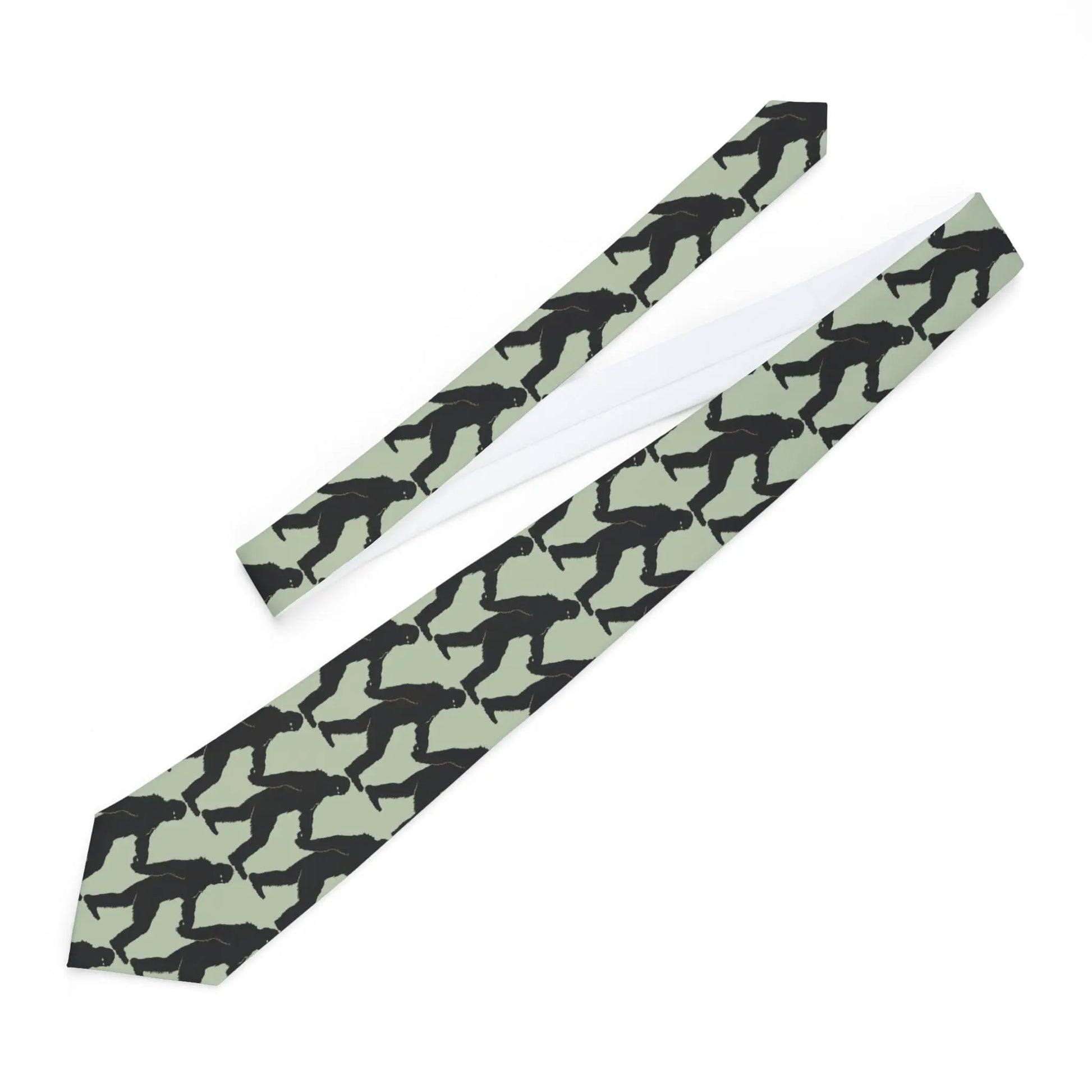 Necktie with black bigfoot silhouette pattern on a light green background