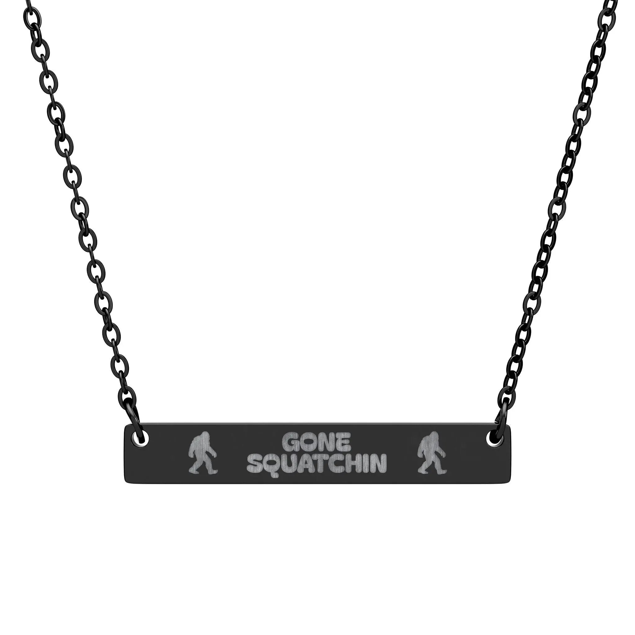 Necklace with 'Gone Squatchin' black pendant on a black chain against a white background