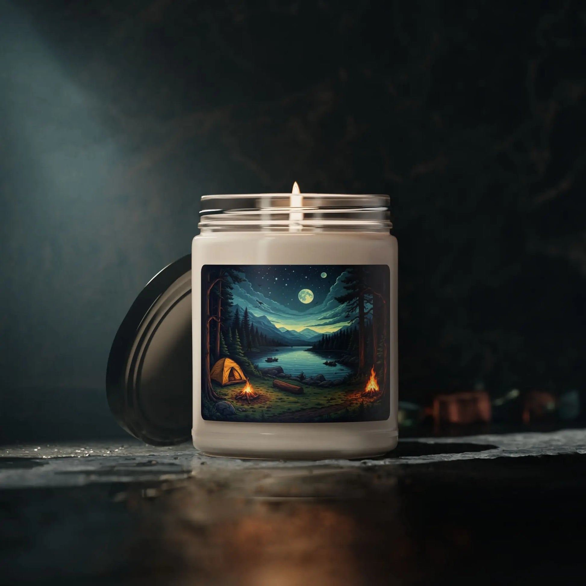 Candle with a scenic design on the packaging in a dark setting