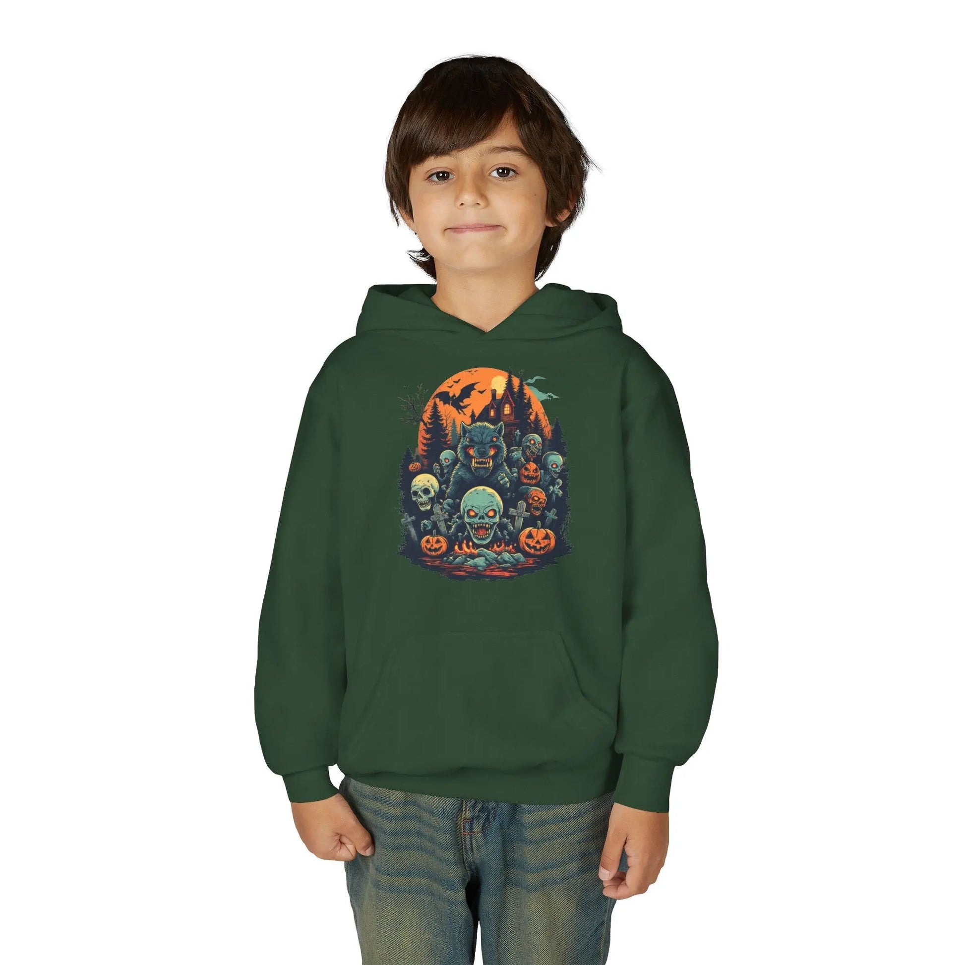 Child wearing a green hoodie with a colorful Halloween graphic design of werewolves, zombies, and other cryptids on a white background