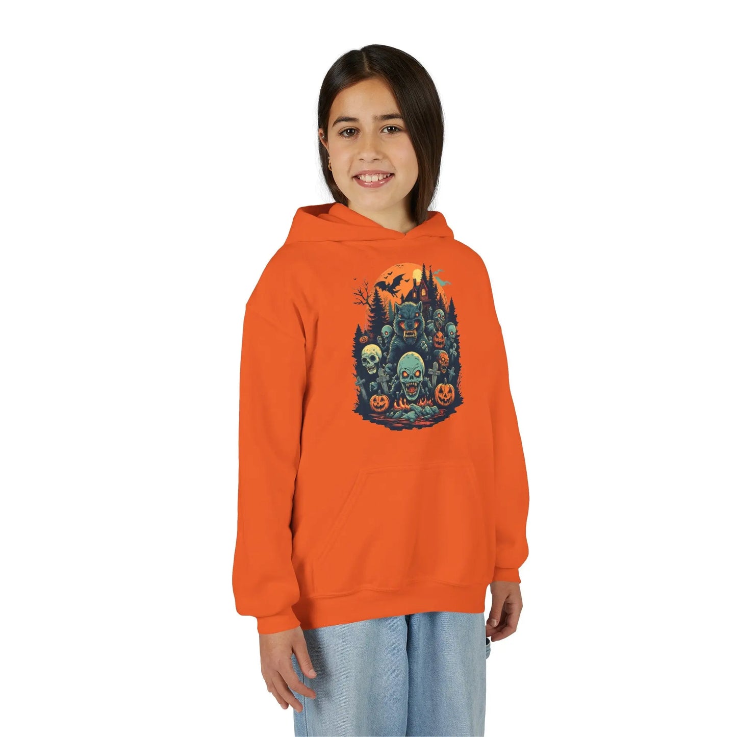 Older child wearing an orange hoodie with a colorful Halloween graphic design of werewolves, zombies, and other cryptids on a white background