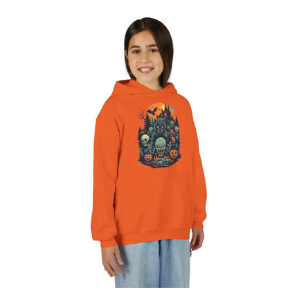 Older child wearing an orange hoodie with a colorful Halloween graphic design of werewolves, zombies, and other cryptids on a white background