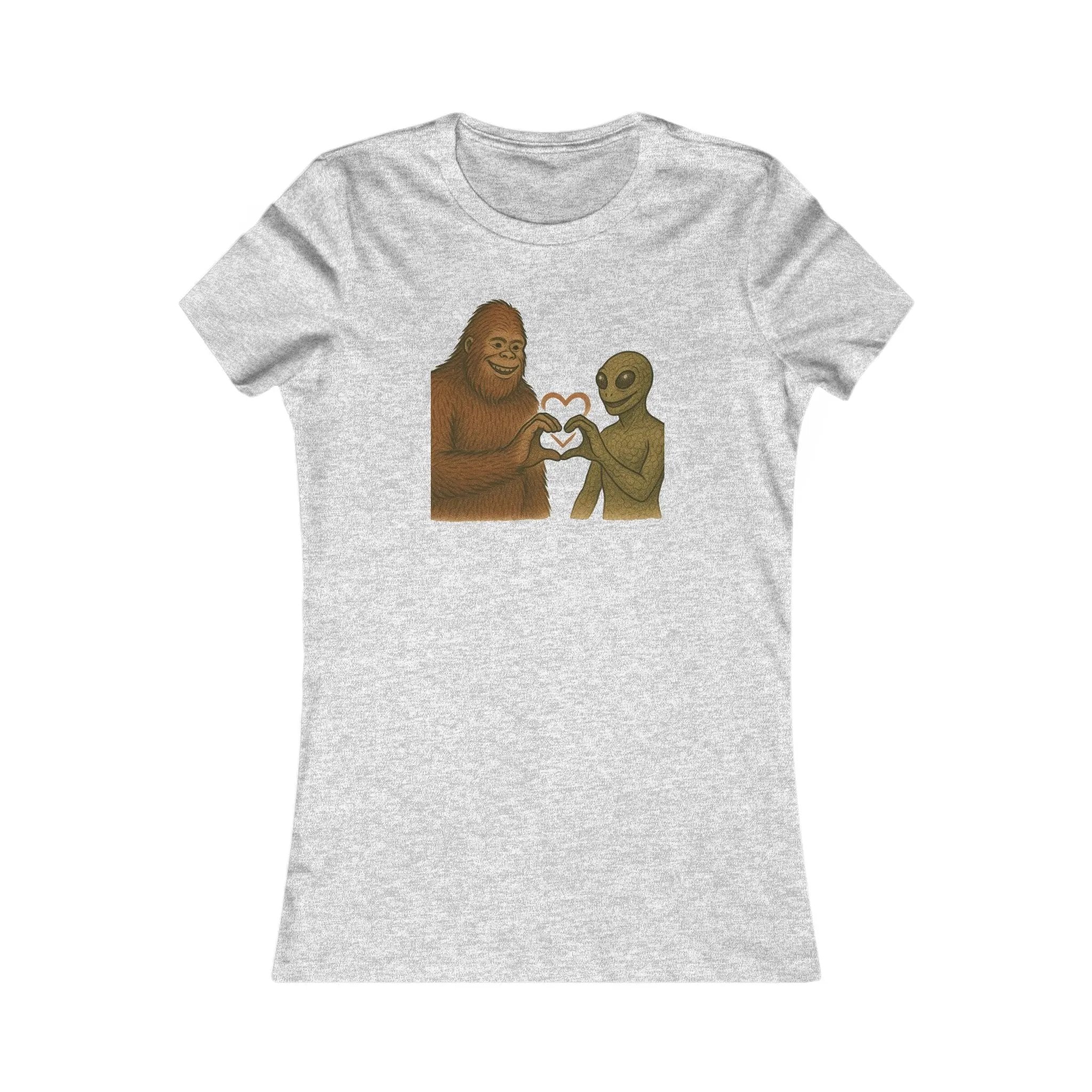 Gray t-shirt with a graphic of a bigfoot and an alien holding hands making a heart symbol on a white background
