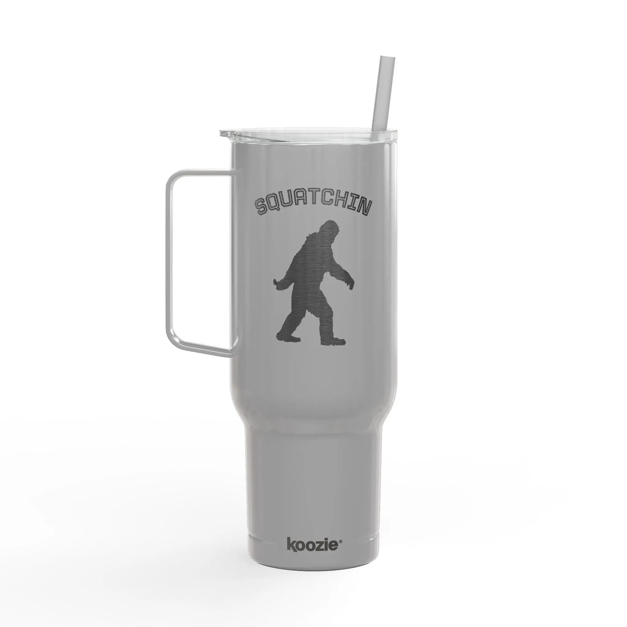 Gray tumbler with 'Squatchin' design and handle on a white background