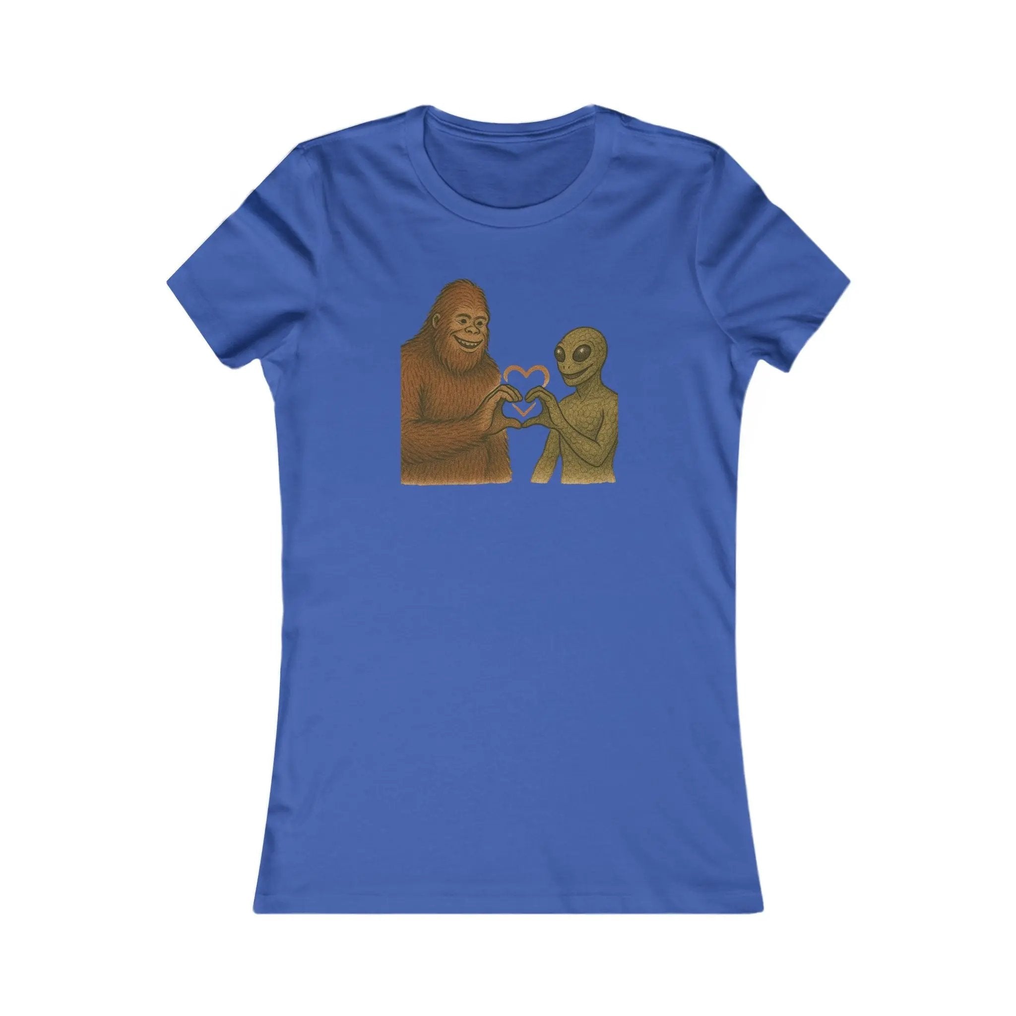 Blue t-shirt with a graphic of a bigfoot and an alien holding hands making a heart symbol on a white background