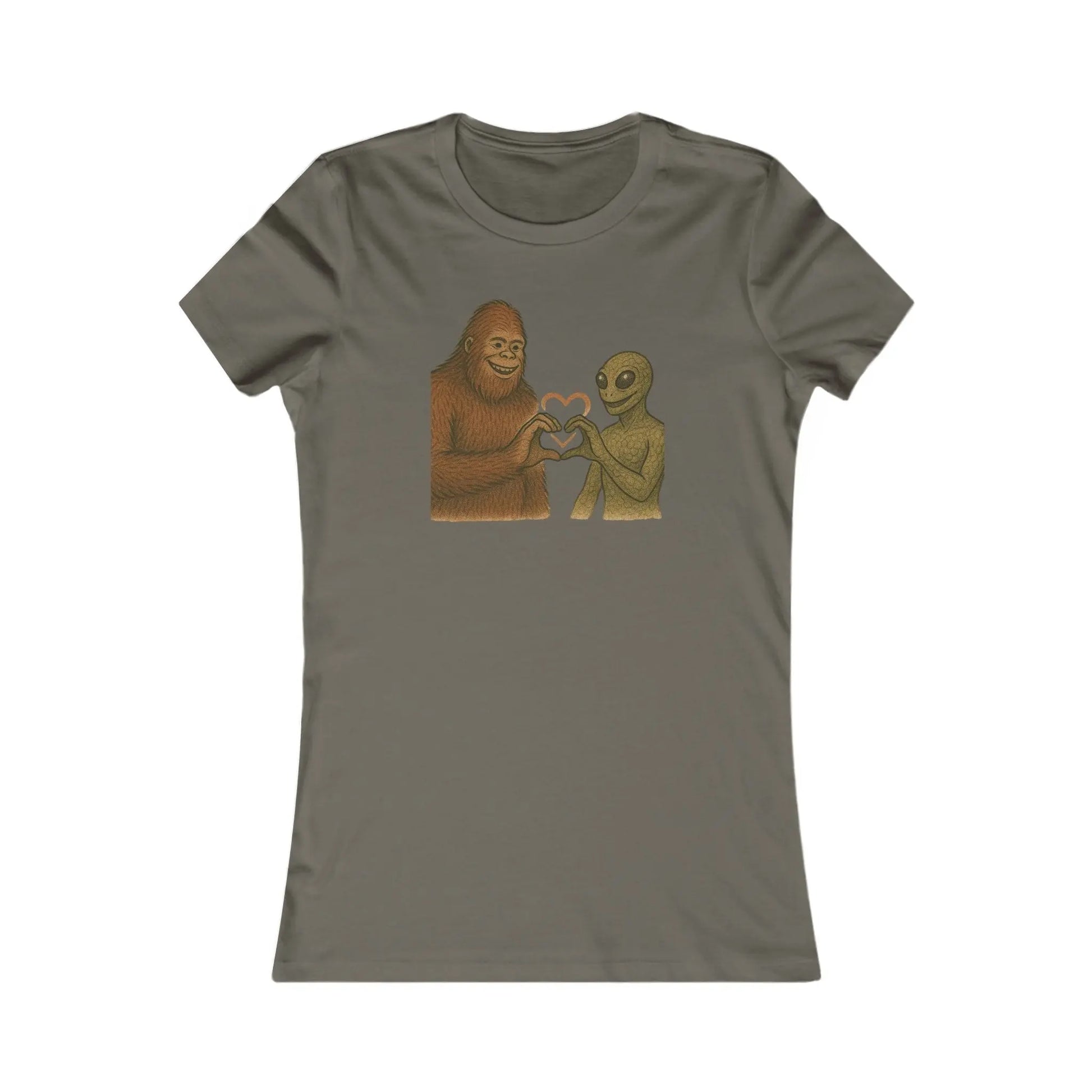 Gray t-shirt with a graphic of a bigfoot and an alien holding hands making a heart symbol on a white background