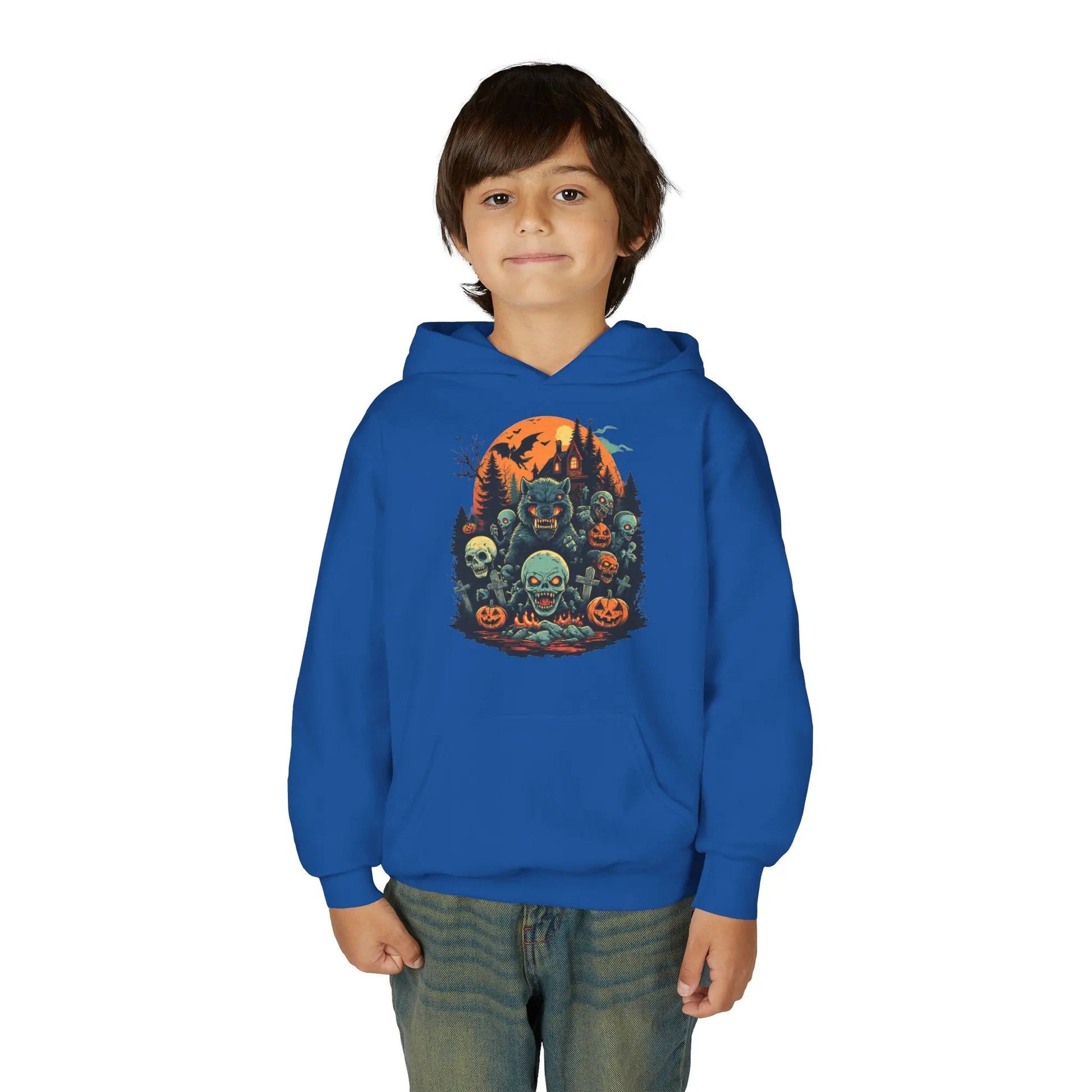 Child wearing a blue hoodie with a colorful Halloween graphic design of werewolves, zombies, and other cryptids on a white background