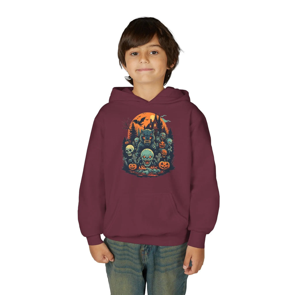 Child wearing a maroon hoodie with a colorful Halloween graphic design of werewolves, zombies, and other cryptids on a white background