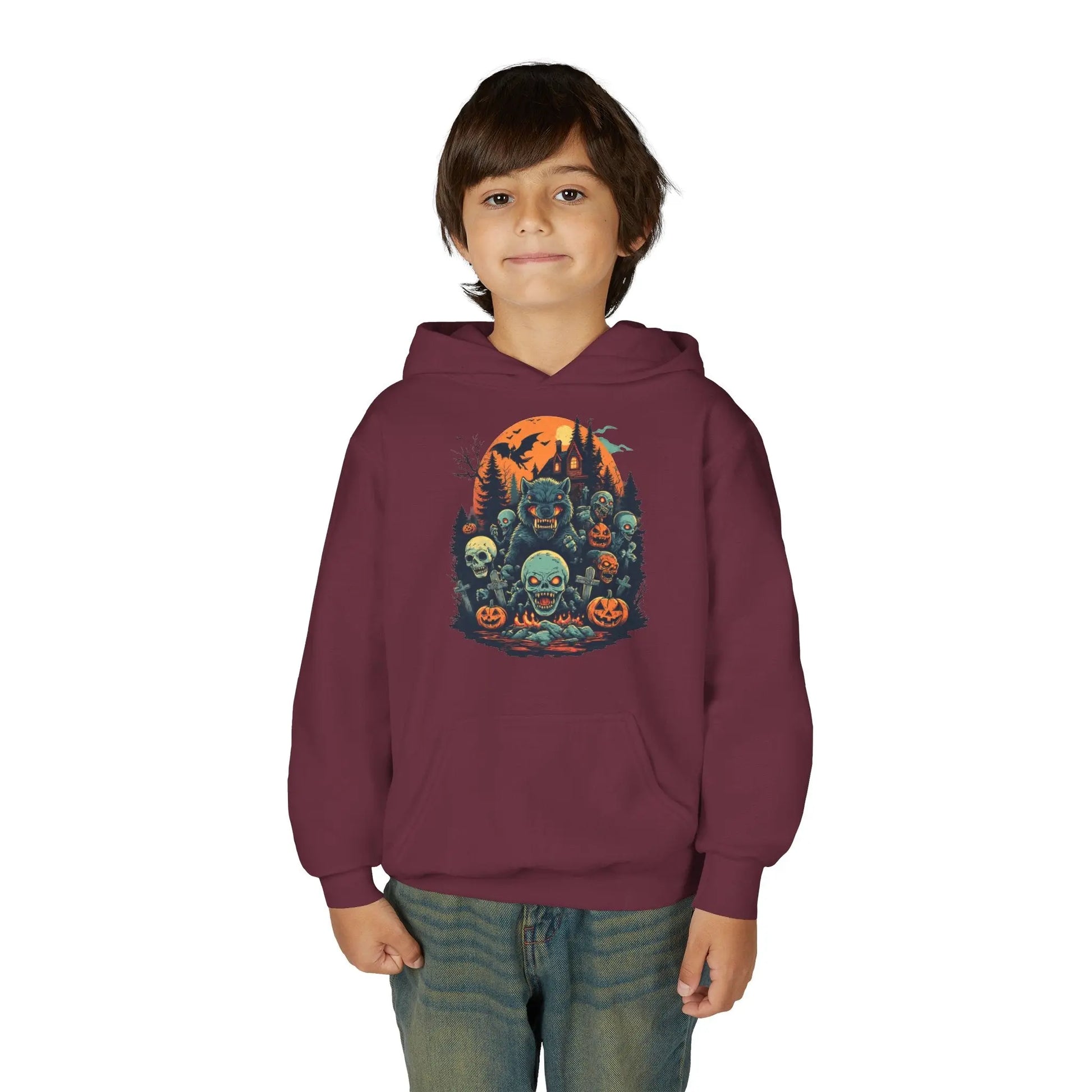 Child wearing a maroon hoodie with a colorful Halloween graphic design of werewolves, zombies, and other cryptids on a white background