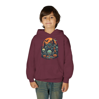 Child wearing a maroon hoodie with a colorful Halloween graphic design of werewolves, zombies, and other cryptids on a white background