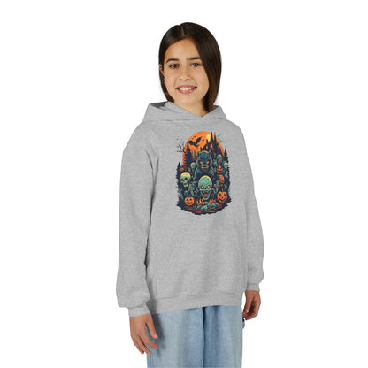 Older child wearing a gray hoodie with a colorful Halloween graphic design of werewolves, zombies, and other cryptids on a white background