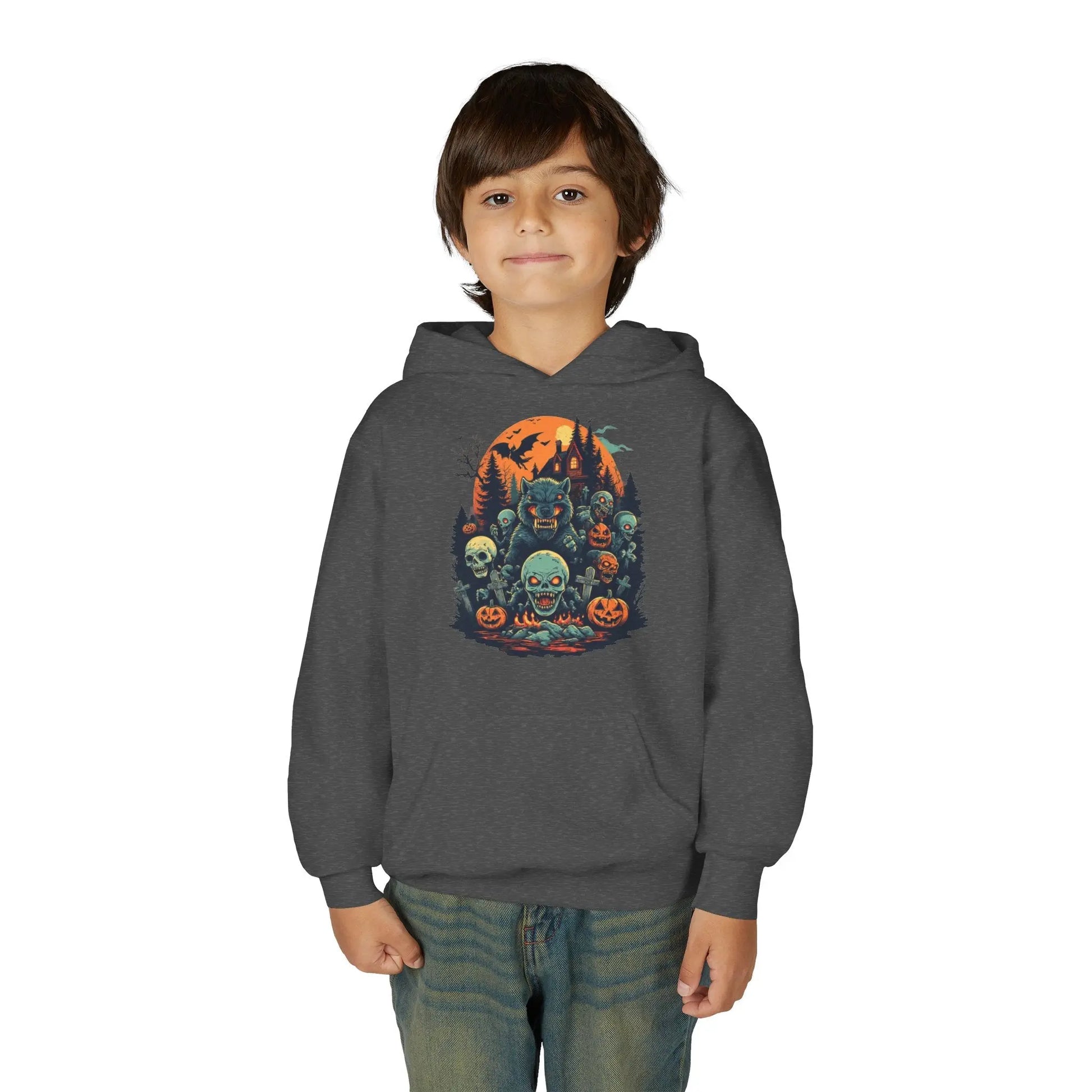 Child wearing a dark gray hoodie with a colorful Halloween graphic design of werewolves, zombies, and other cryptids on a white background