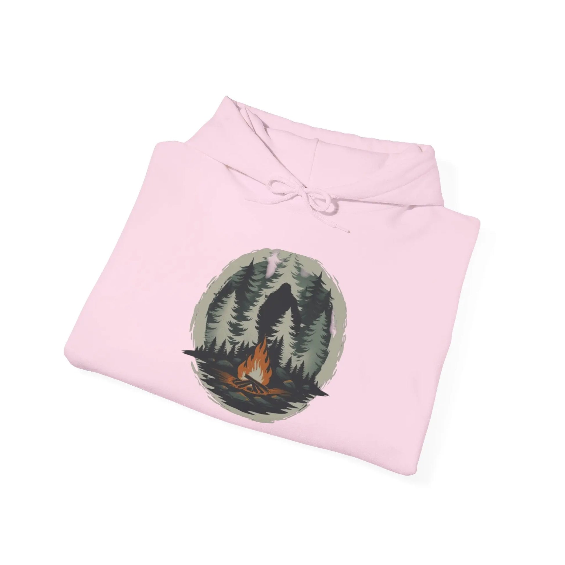 Folded Pink hoodie with nature graphic on a white background