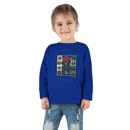 Child wearing a blue long sleeve shirt with a graphic collage design on a white background