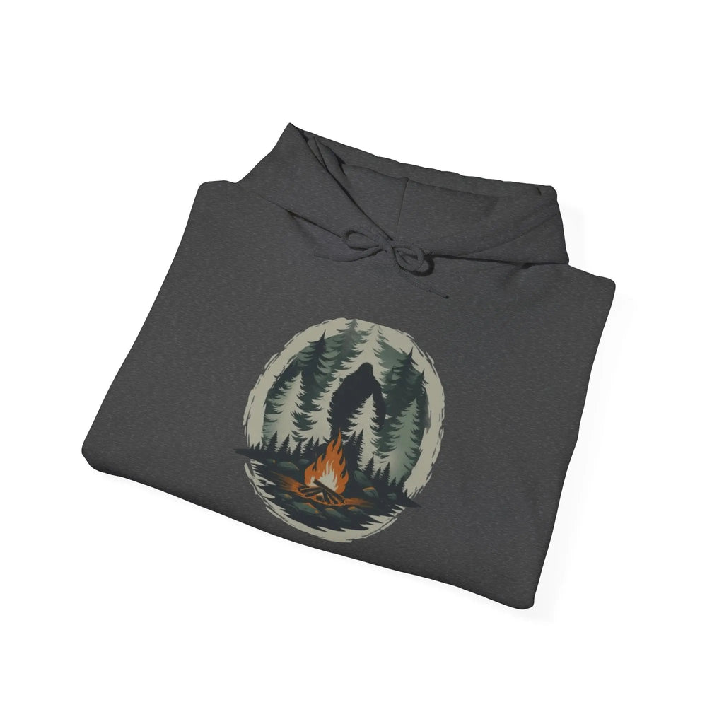 Folded dark gray hoodie with nature graphic on a white background