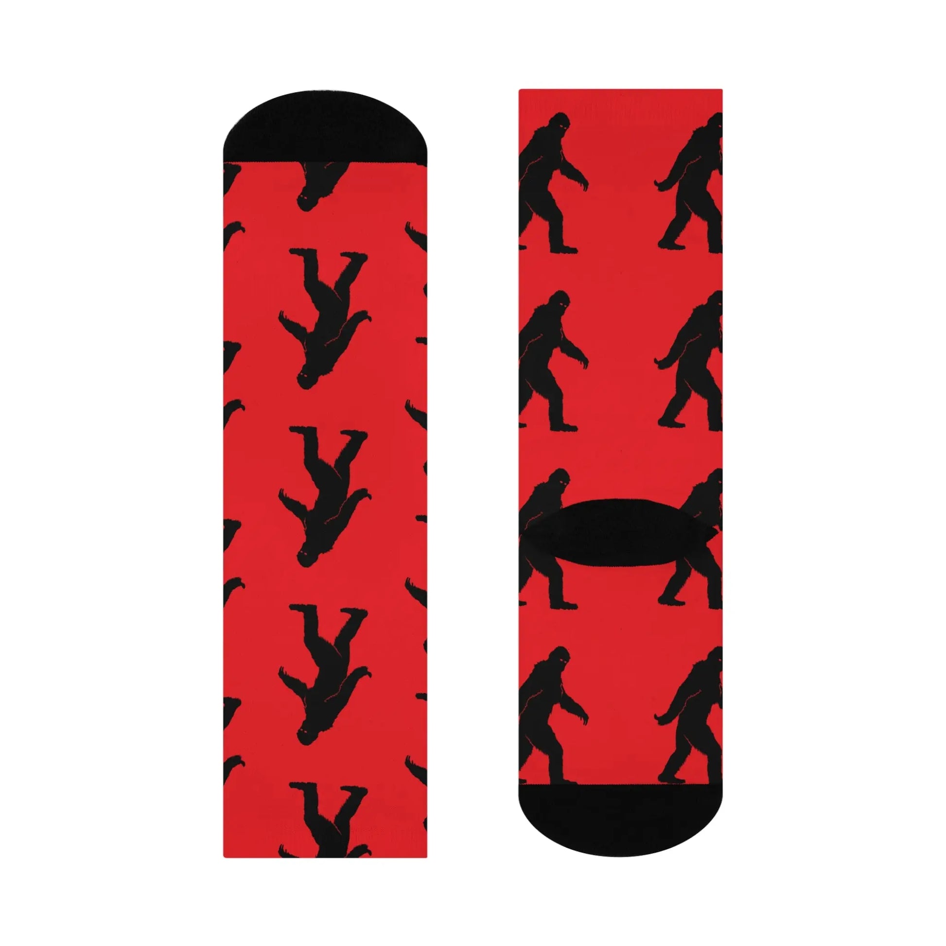 Socks with black bigfoot silhouette pattern on a red background