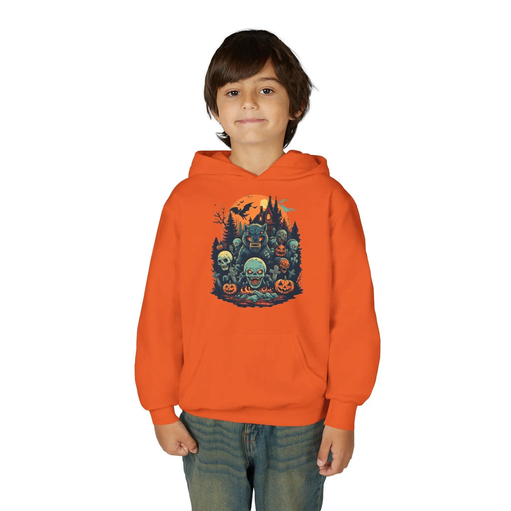 Child wearing an orange hoodie with a colorful Halloween graphic design of werewolves, zombies, and other cryptids on a white background