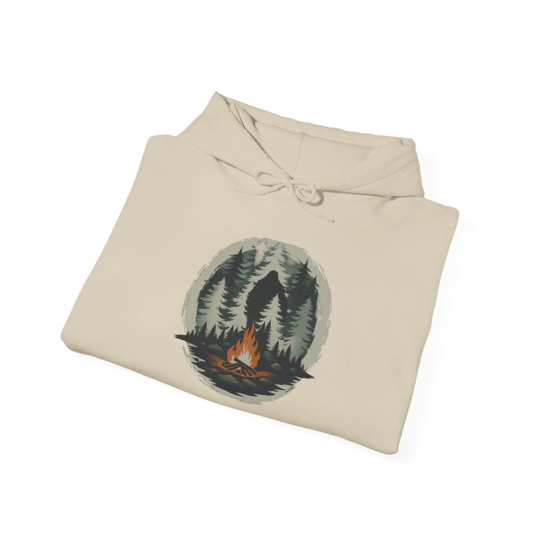 Folded hoodie with a nature graphic on a white background