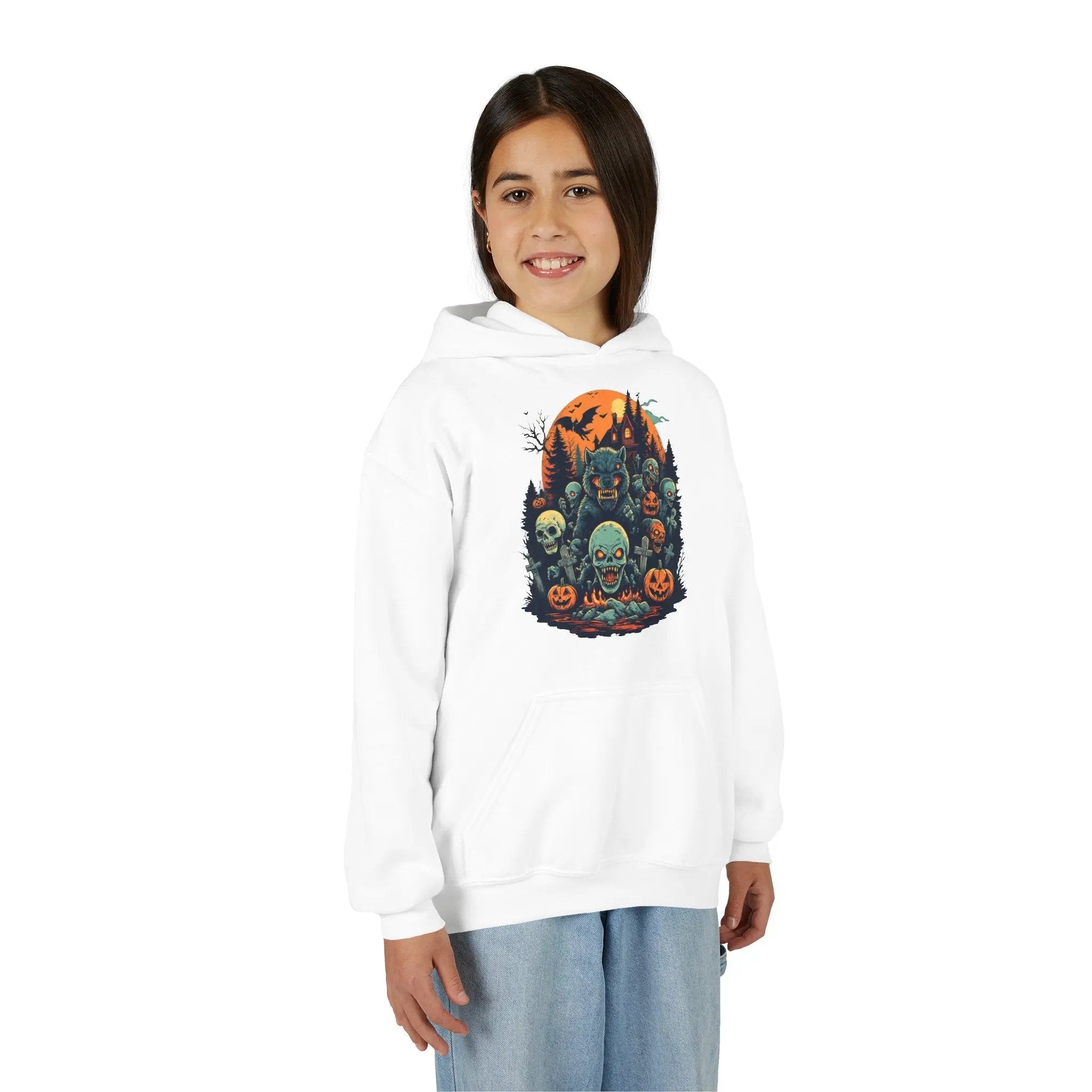 Older child wearing a white hoodie with a colorful Halloween graphic design of werewolves, zombies, and other cryptids on a white background