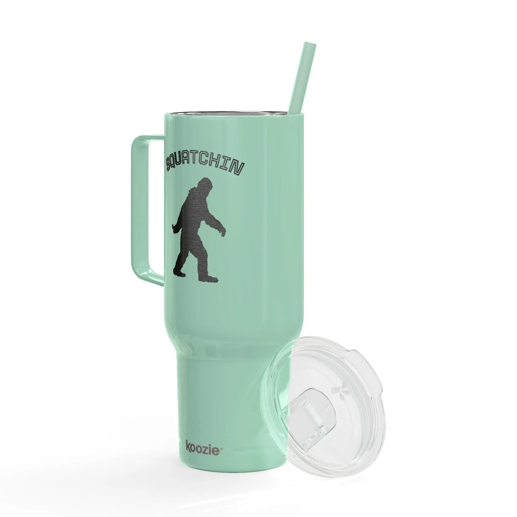 Mint green tumbler with a handle, straw, and lid on a white background