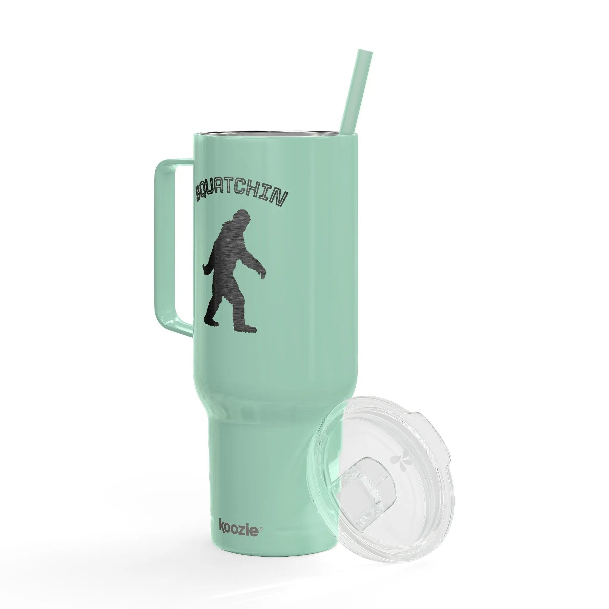 Mint green tumbler with a handle, straw, and lid on a white background
