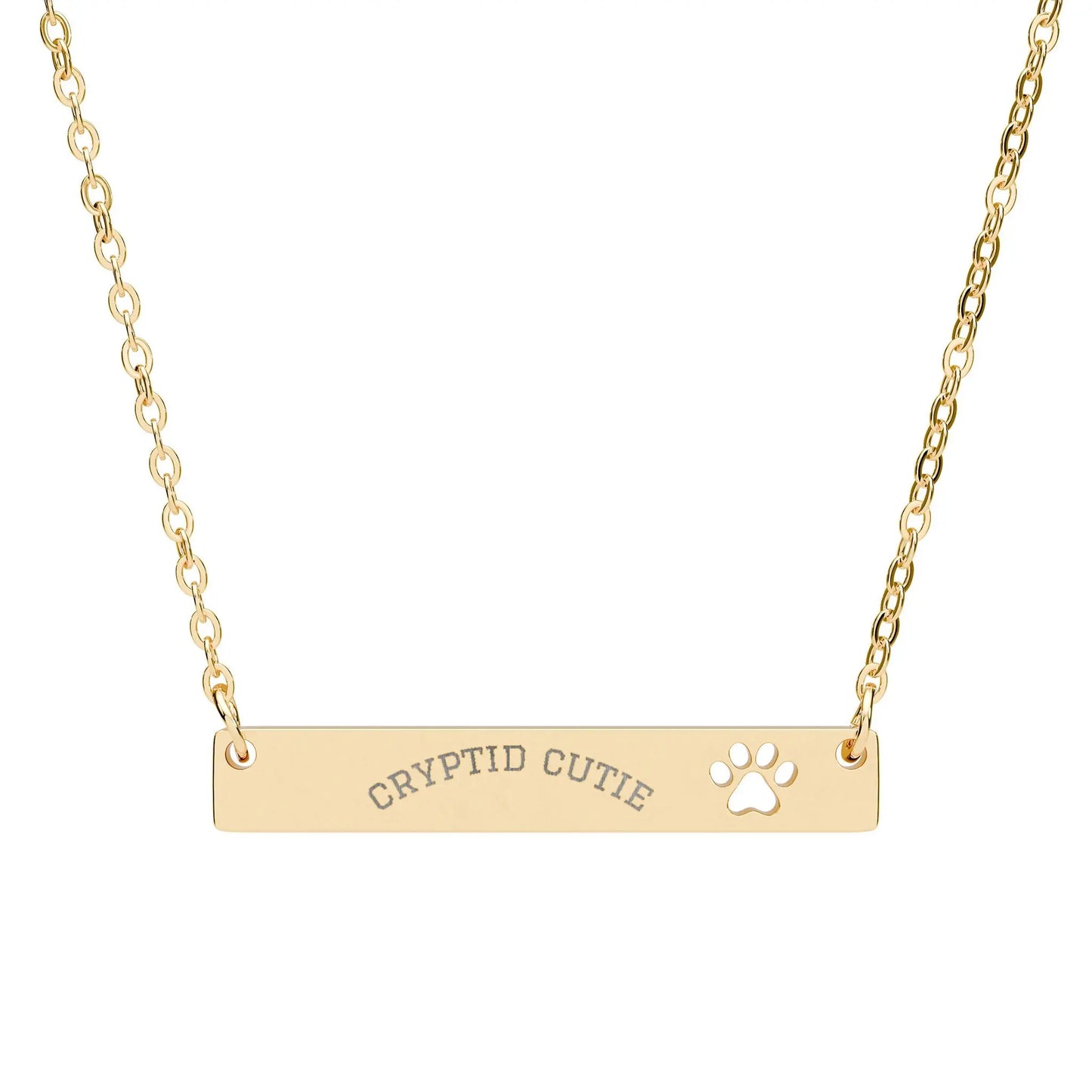 Gold necklace with 'CRYPTID CUTIE' and paw print on a white background