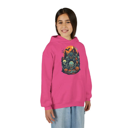 Older child wearing a pink hoodie with a colorful Halloween graphic design of werewolves, zombies, and other cryptids on a white background