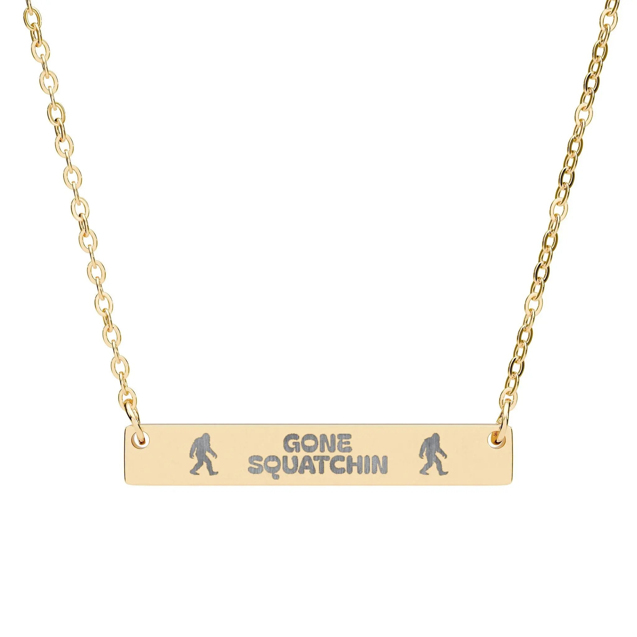 Gold plated necklace with 'Gone Squatchin' bar pendant on a white background