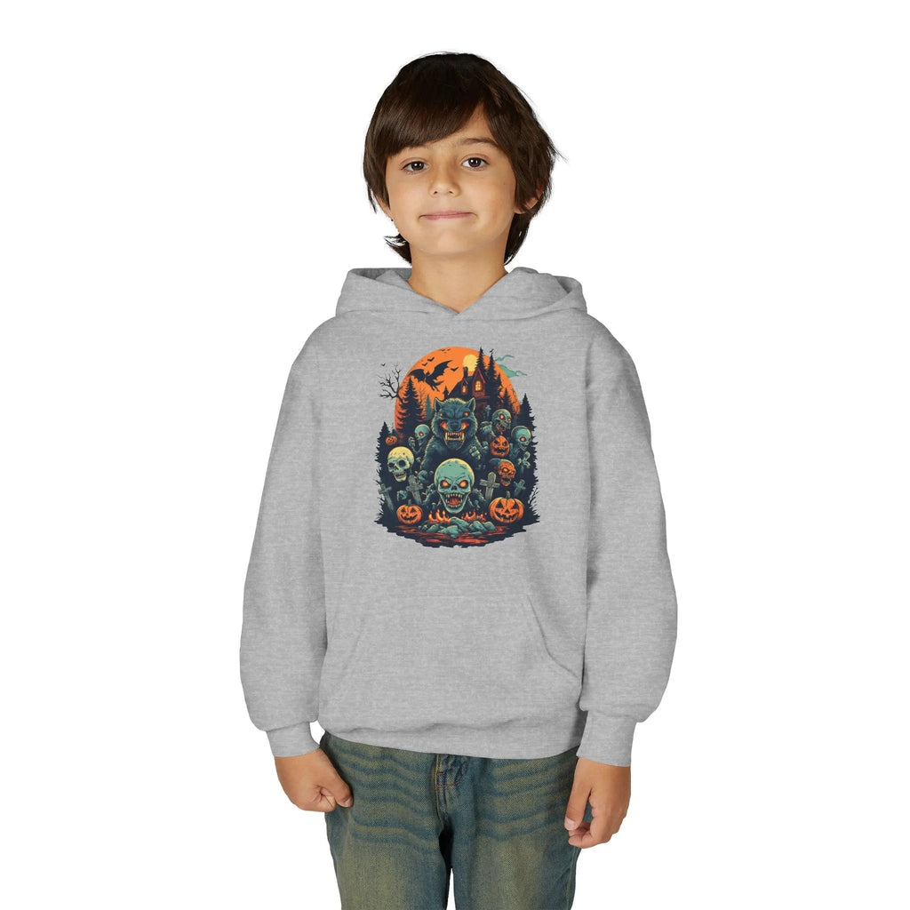 Child wearing a gray hoodie with a colorful Halloween graphic design of werewolves, zombies, and other cryptids on a white background