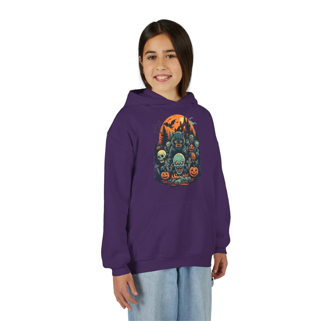 Older child wearing a purple hoodie with a colorful Halloween graphic design of werewolves, zombies, and other cryptids on a white background