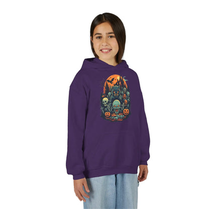 Older child wearing a purple hoodie with a colorful Halloween graphic design of werewolves, zombies, and other cryptids on a white background